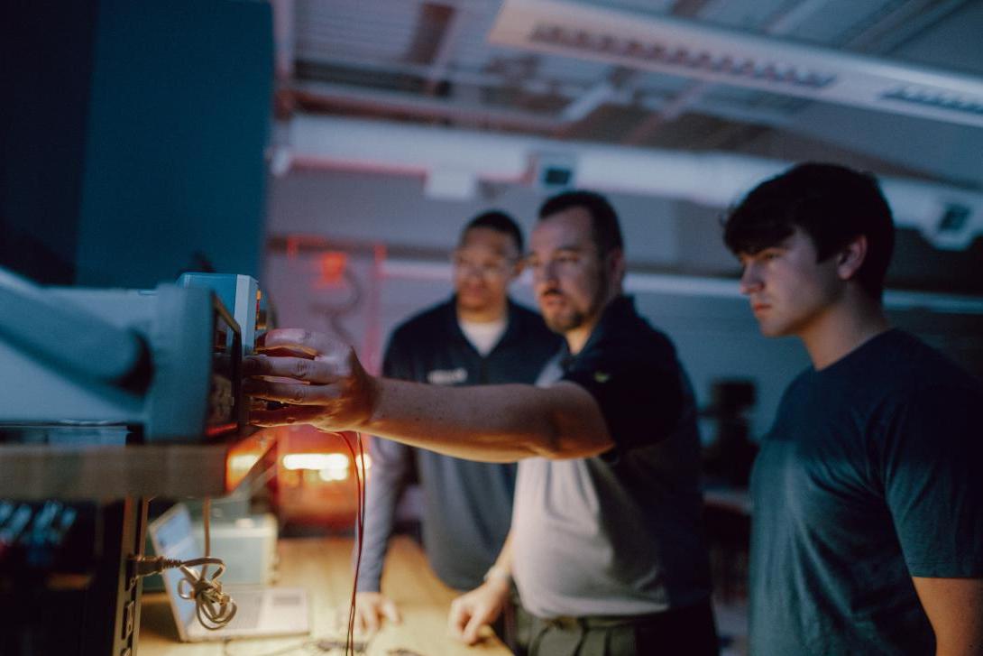 professor and students in design circut lab